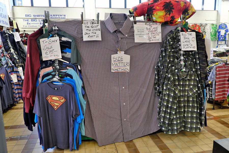 Giant check shirt with sign saying size matters sometimes at Fleetwood Market stall