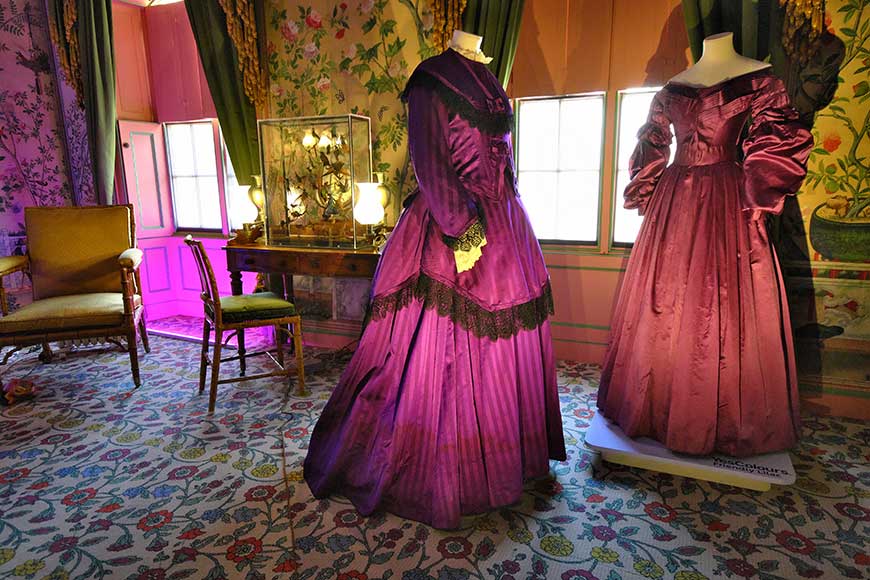 Victorian purple satin dresses at Royal Pavilion Brighton. Showing difference between natural and synthetic dyes.