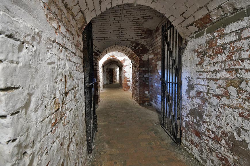 Brick tunnels and iron gate in the caponier Newhaven Fort, East Sussex