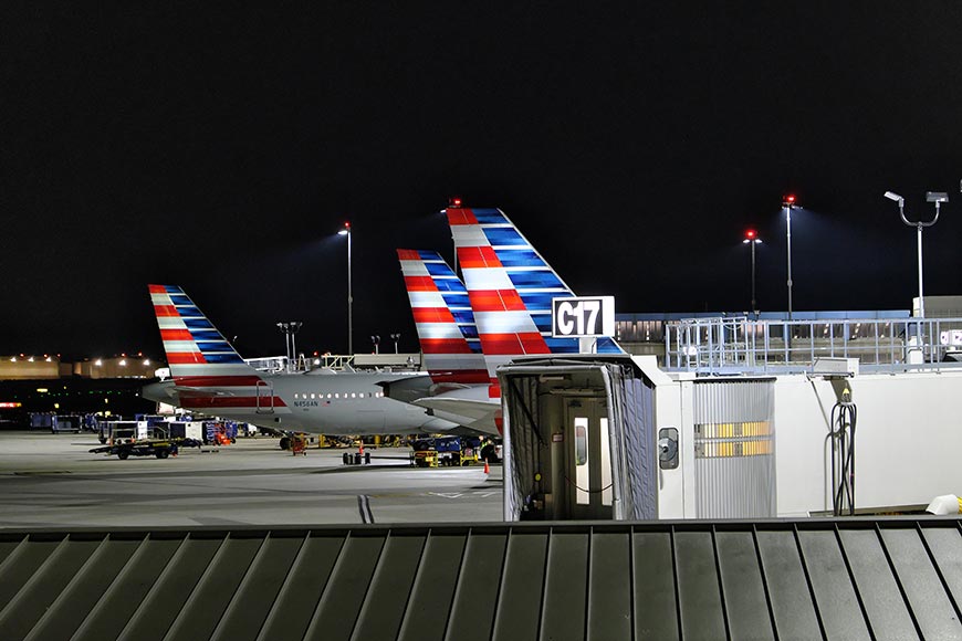 Tail section of American Airlines showing the red, white, and blue stripes