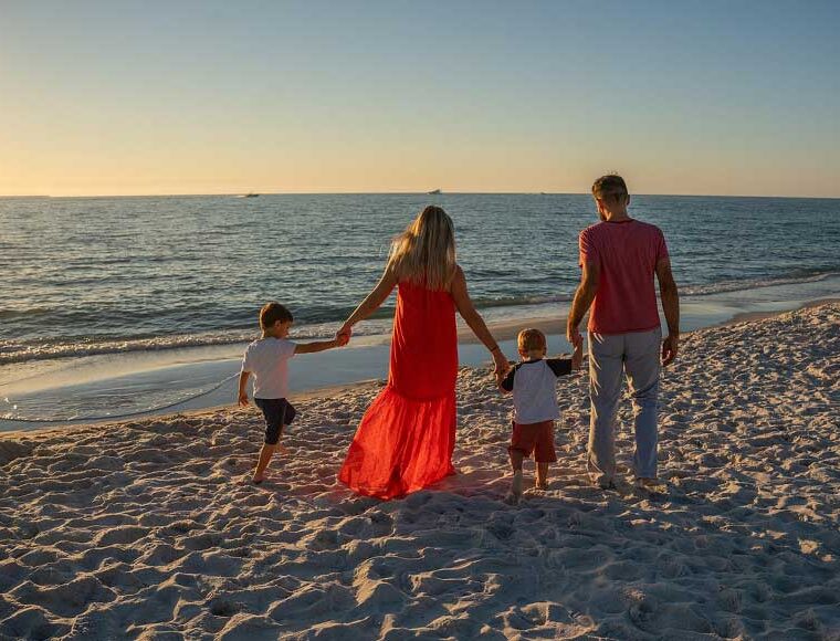 Family on the beach at sunset