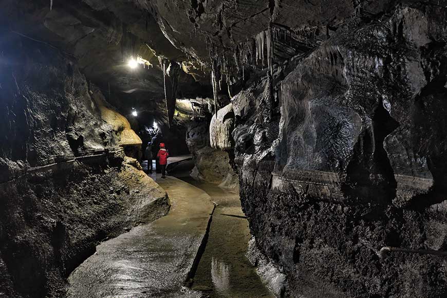 Family on the self guided tour at Ingleborough Cave Yorkshire