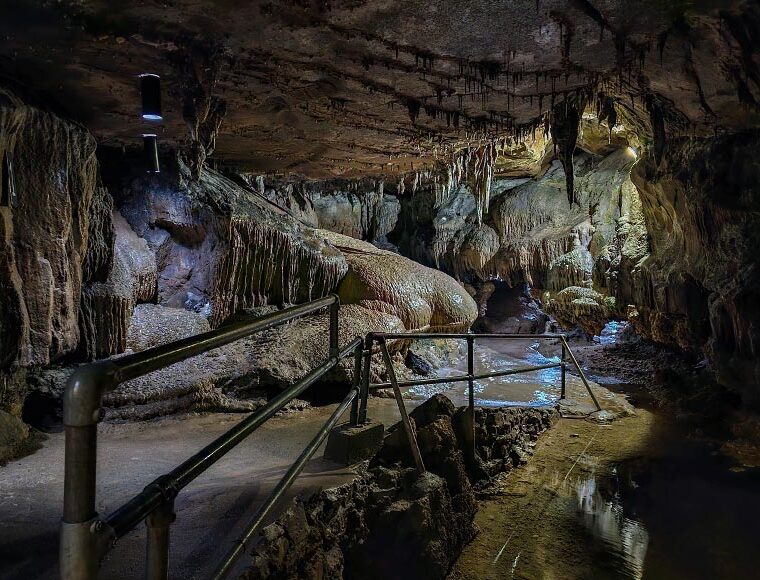 Concrete path and railings inside Ingleborough Cave in Yorkshire Dales UK