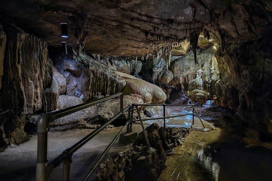 Concrete path and railings inside Ingleborough Cave in Yorkshire Dales UK