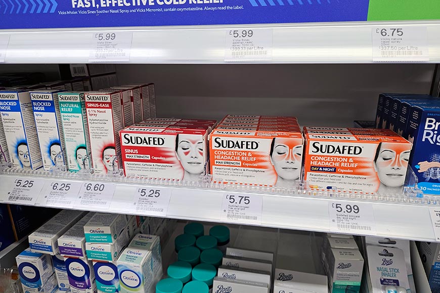 Packets of Sudafed medication on a shelf at Boots Chemist
