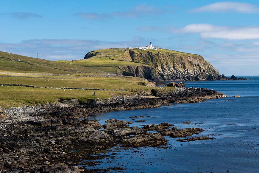 Sumburgh Head, Nature reserve with the lighthouse in the distance located at the southern tip of the Shetland Islands in Scotland.