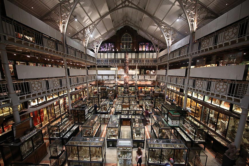 Photo of the interior of Pitt Rivers Museum from the second floor facing away from the entrance