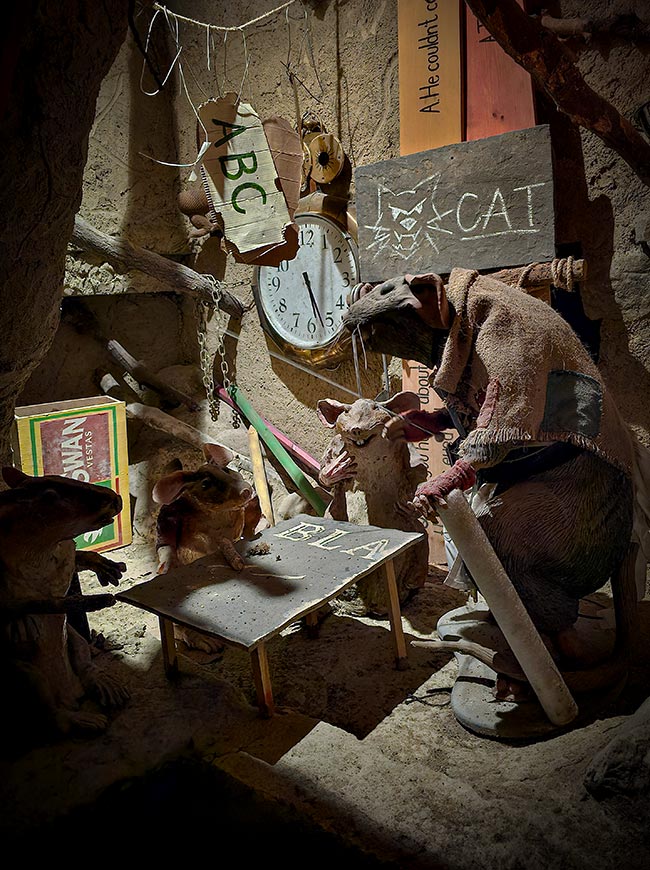 Animatronic rat figures inside the underground labyrinth at The Forbidden Corner