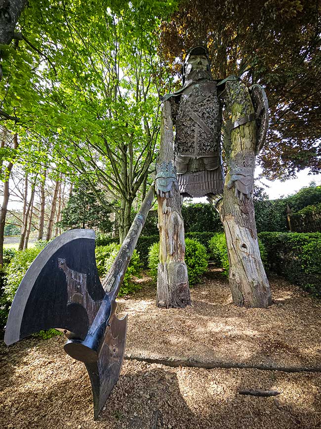 Giant woodcutter and axe statue at The Forbidden Corner