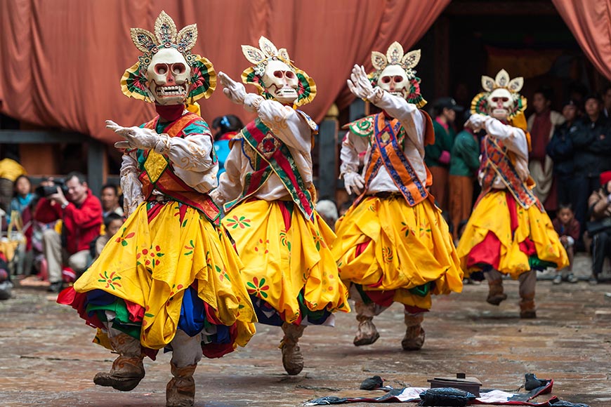 Bumthamg, Bhutan, 05 Nov 2011: Dancers  in colourful costumes performing at Jakar Festival.